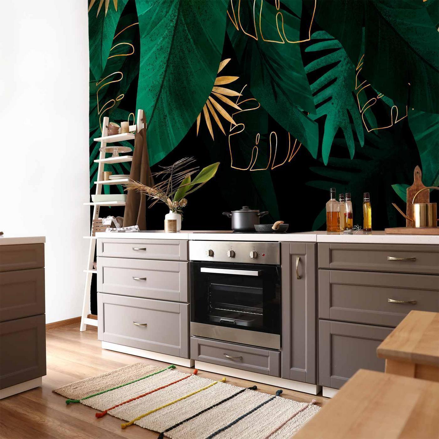 Fotobehang - Jungle and composition - motif of green and golden leaves on a black background