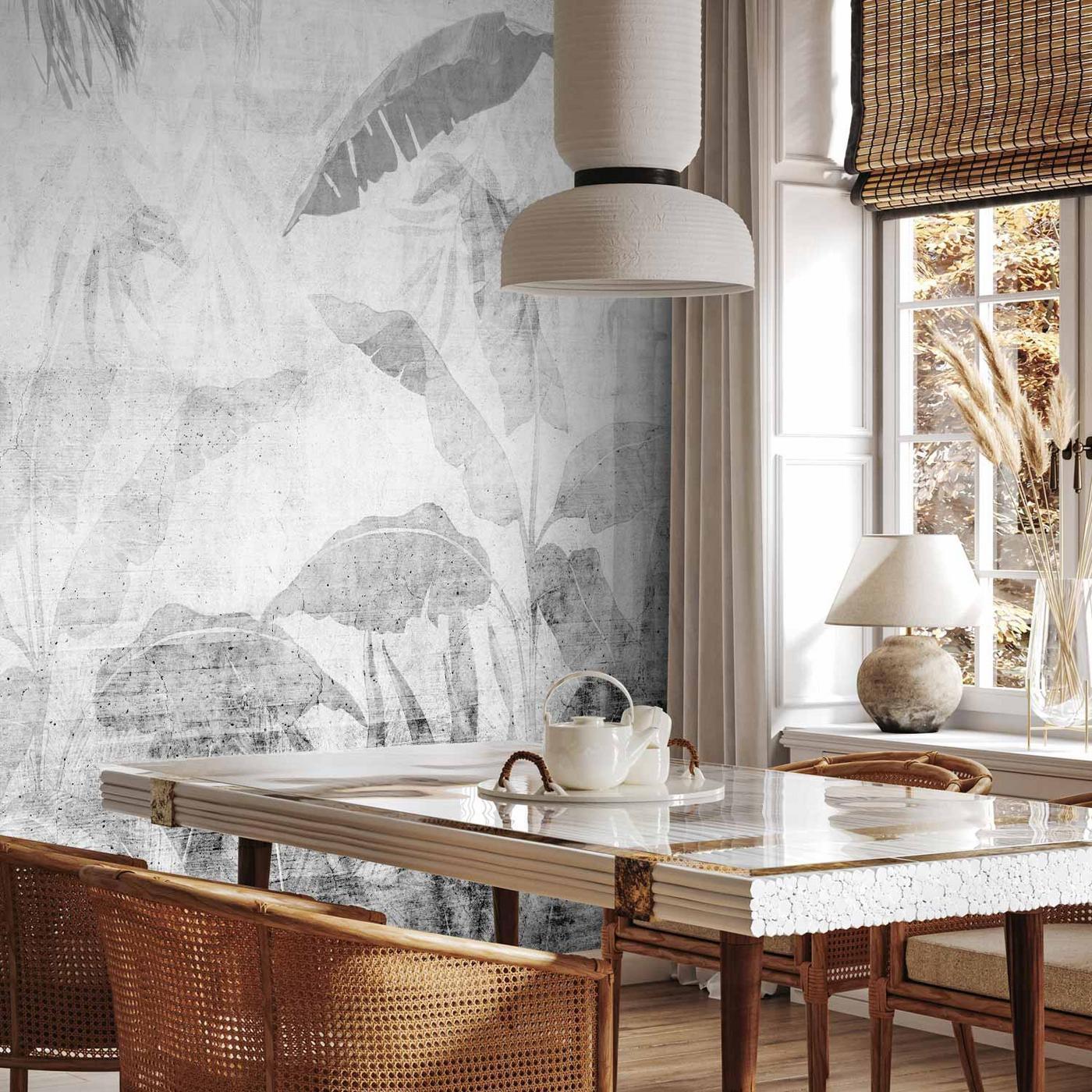 Fotobehang - Vanishing jungle - landscape of exotic trees and leaves in grey tones